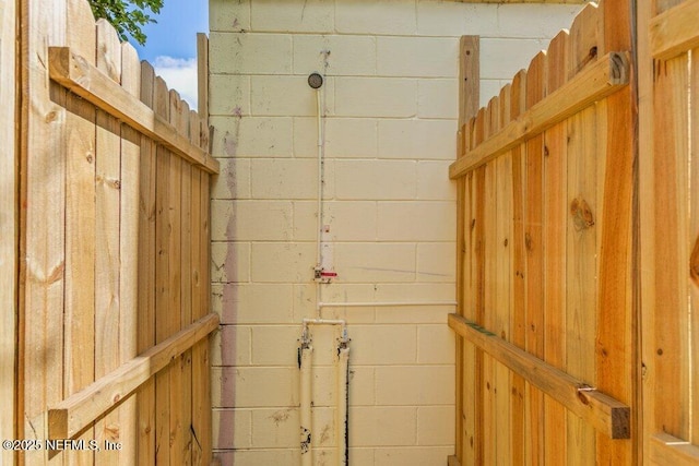 exterior space with concrete block siding