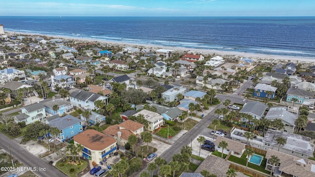 drone / aerial view with a water view and a view of the beach