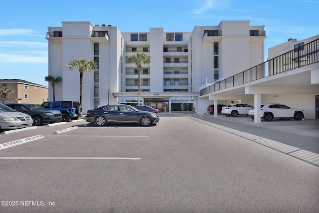 view of property featuring uncovered parking