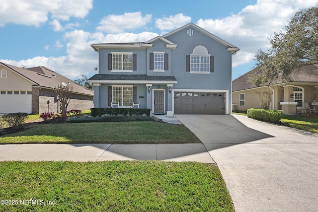 traditional-style house with an attached garage, a front lawn, concrete driveway, and stucco siding