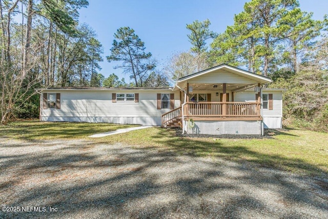 view of front of home featuring covered porch and a front lawn