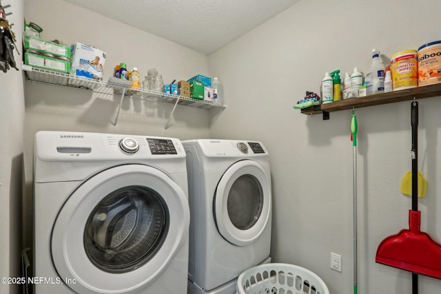 clothes washing area with laundry area and washing machine and dryer