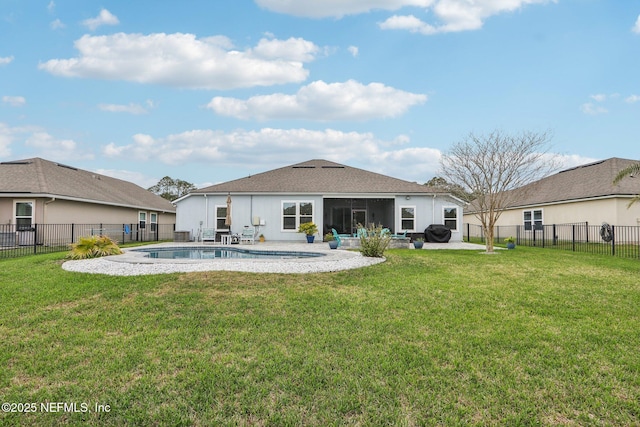 rear view of property with a patio area, a lawn, and a fenced backyard