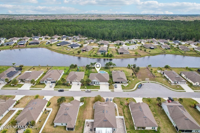 drone / aerial view with a water view and a residential view