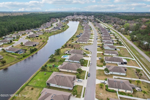 bird's eye view featuring a residential view and a water view