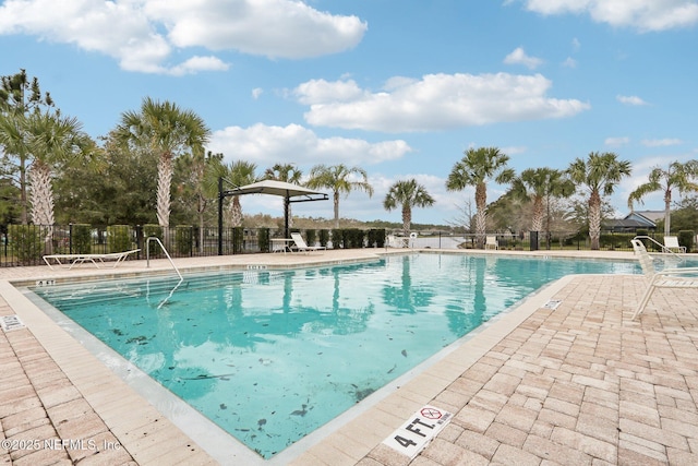 pool featuring a patio and fence