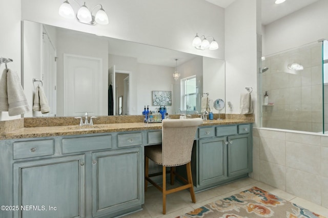 full bathroom with walk in shower, tile patterned flooring, and vanity