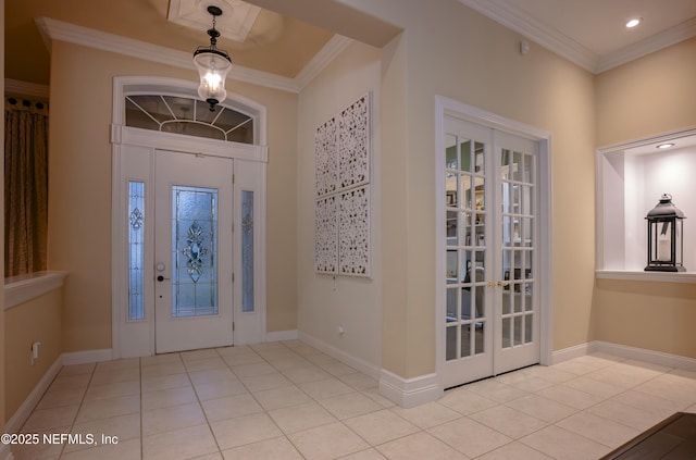 tiled foyer entrance with baseboards, crown molding, and recessed lighting