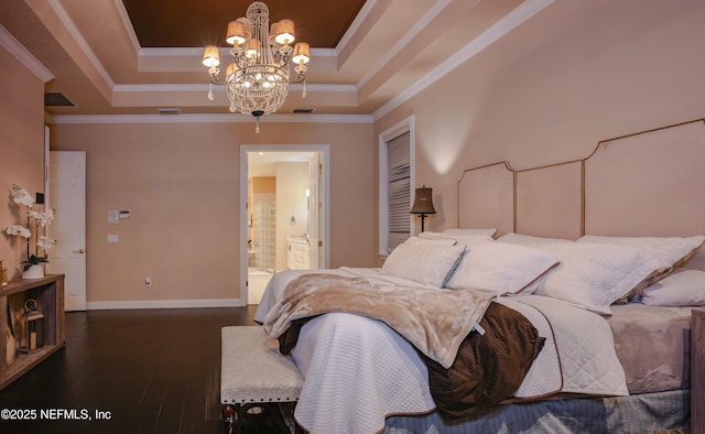 bedroom with wood finished floors, visible vents, baseboards, ornamental molding, and a tray ceiling