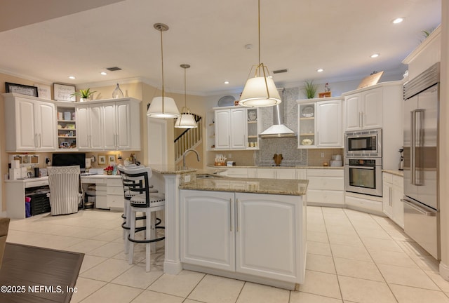 kitchen featuring built in appliances, crown molding, wall chimney range hood, open shelves, and a sink