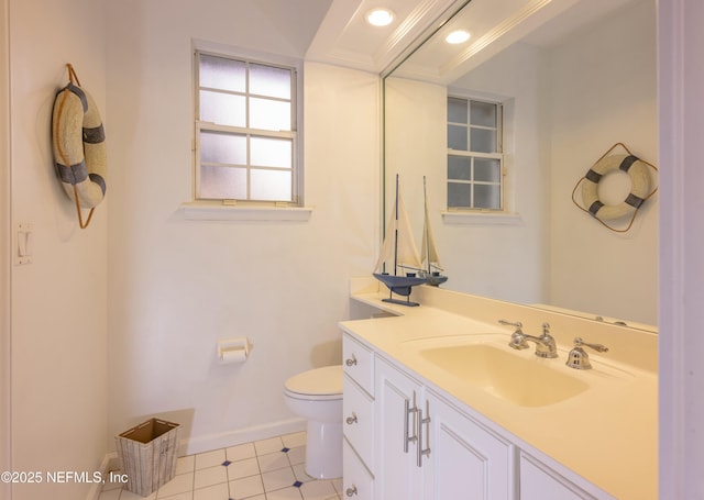 bathroom featuring toilet, recessed lighting, baseboards, and vanity