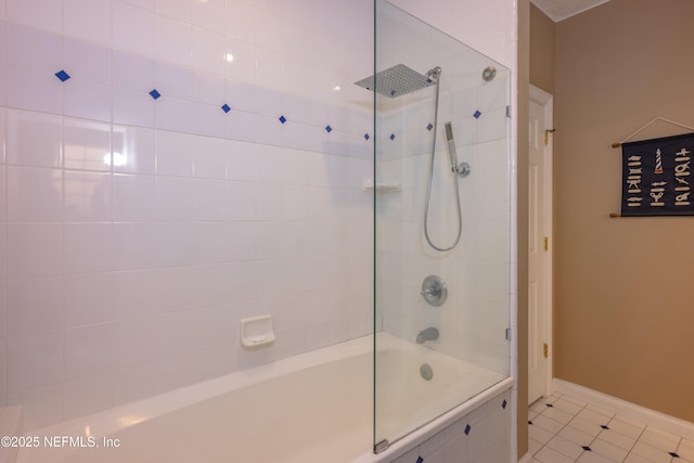 full bath with tiled shower / bath, tile patterned floors, and baseboards