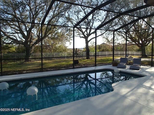 view of pool with a lanai, a fenced backyard, a fenced in pool, and a patio