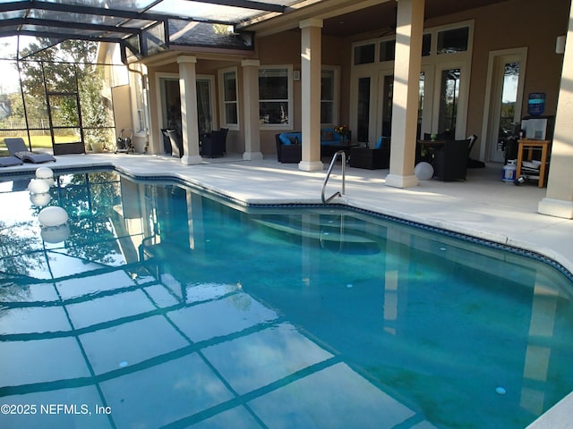 pool featuring an outdoor hangout area, a patio, and a lanai