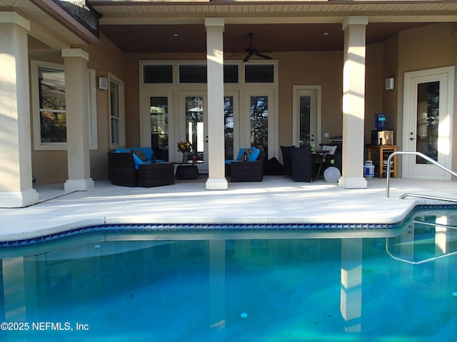 pool with a ceiling fan, french doors, a patio, and an outdoor living space