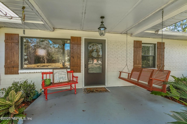 entrance to property with covered porch