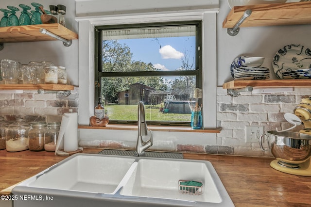 details featuring sink and wooden counters