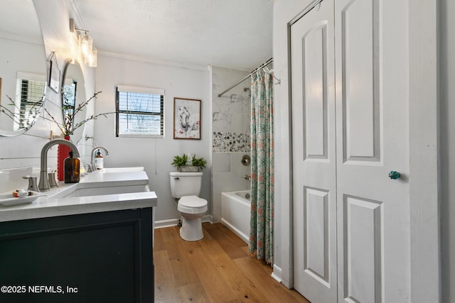 full bathroom with ornamental molding, shower / bath combo with shower curtain, toilet, wood-type flooring, and vanity