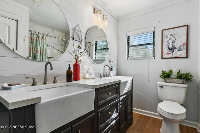 bathroom with vanity, walk in shower, toilet, hardwood / wood-style flooring, and ornamental molding