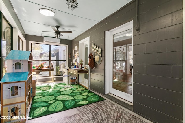 sunroom / solarium with an AC wall unit and ceiling fan