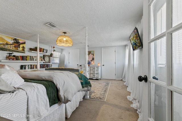 carpeted bedroom with a textured ceiling