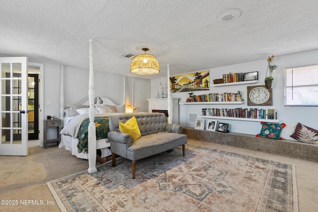 carpeted bedroom with a textured ceiling