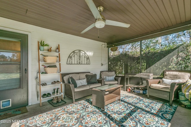 sunroom / solarium with ceiling fan and wood ceiling