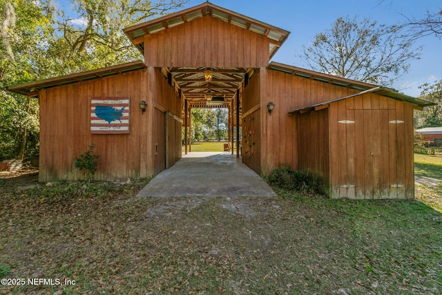 view of property exterior featuring an outbuilding