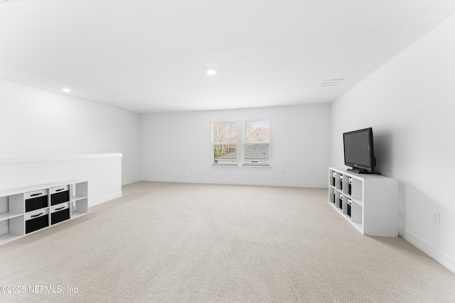 unfurnished living room with light carpet, recessed lighting, visible vents, and baseboards