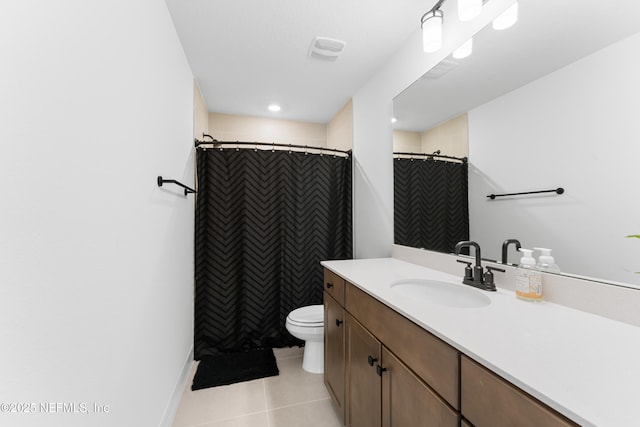 bathroom with visible vents, a shower with shower curtain, toilet, vanity, and tile patterned flooring