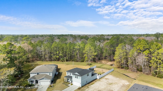 aerial view featuring a wooded view