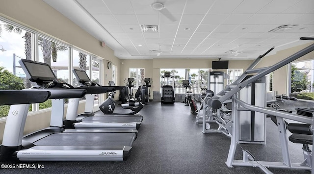 workout area with visible vents and a drop ceiling