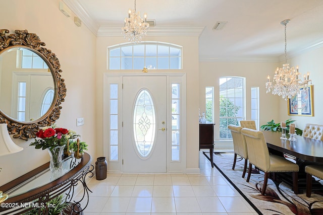 3383 Olympic Dr, Green Cove Springs, FL 32043 - entrance foyer with a chandelier, light tile patterned flooring, and crown molding