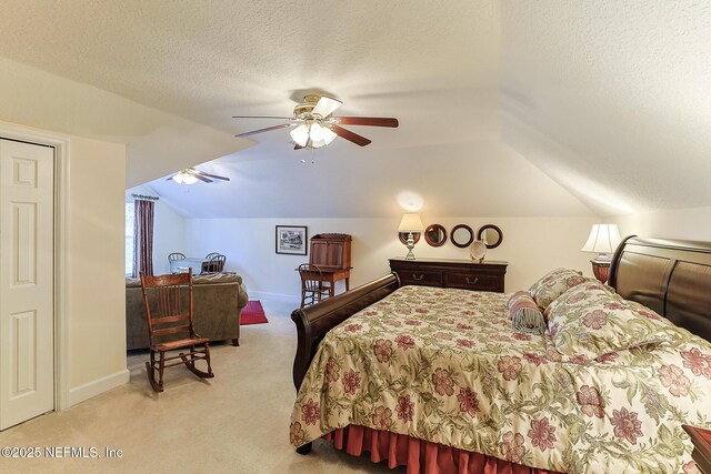 3383 Olympic Dr, Green Cove Springs, FL 32043 - bedroom featuring lofted ceiling, a textured ceiling, baseboards, ceiling fan, and light colored carpet