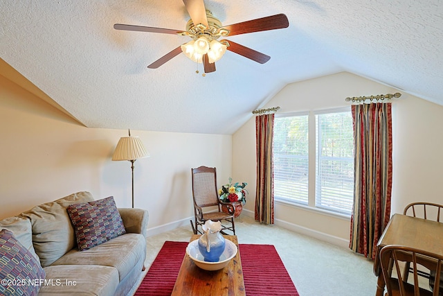3383 Olympic Dr, Green Cove Springs, FL 32043 - living area with a textured ceiling, baseboards, ceiling fan, light colored carpet, and vaulted ceiling