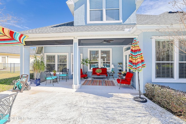 3383 Olympic Dr, Green Cove Springs, FL 32043 - property entrance featuring ceiling fan, fence, a patio area, and roof with shingles