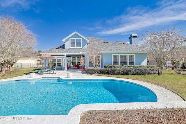 3383 Olympic Dr, Green Cove Springs, FL 32043 - view of pool featuring a patio area, fence, a lawn, and a fenced in pool