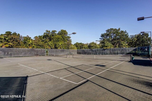 3383 Olympic Dr, Green Cove Springs, FL 32043 - view of tennis court with fence