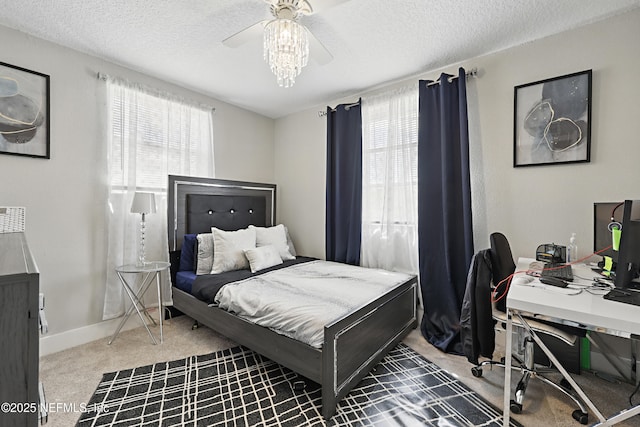 10605 Arnez Rd, Jacksonville, FL 32218 - carpeted bedroom with ceiling fan, a textured ceiling, and baseboards