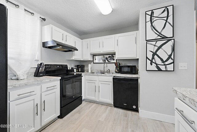 10605 Arnez Rd, Jacksonville, FL 32218 - kitchen featuring white cabinets, a sink, under cabinet range hood, and black appliances