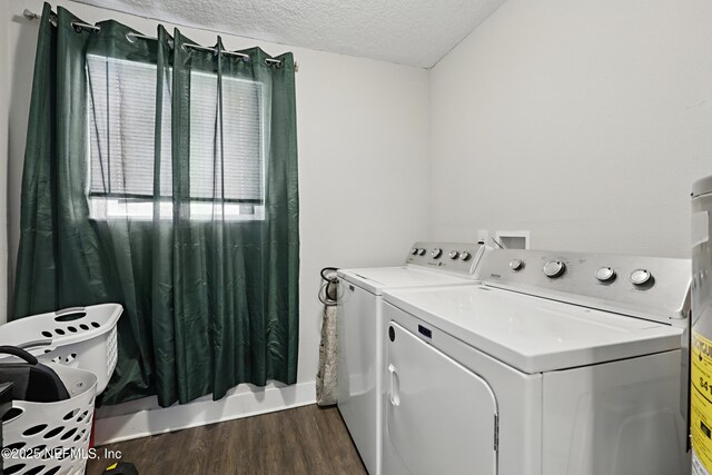 10605 Arnez Rd, Jacksonville, FL 32218 - laundry area with dark wood-type flooring, laundry area, washer and clothes dryer, and a textured ceiling