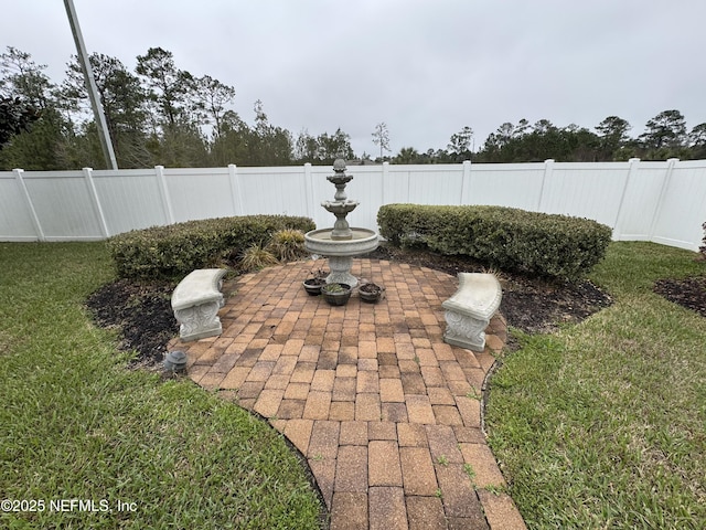 view of yard featuring a patio area and a fenced backyard