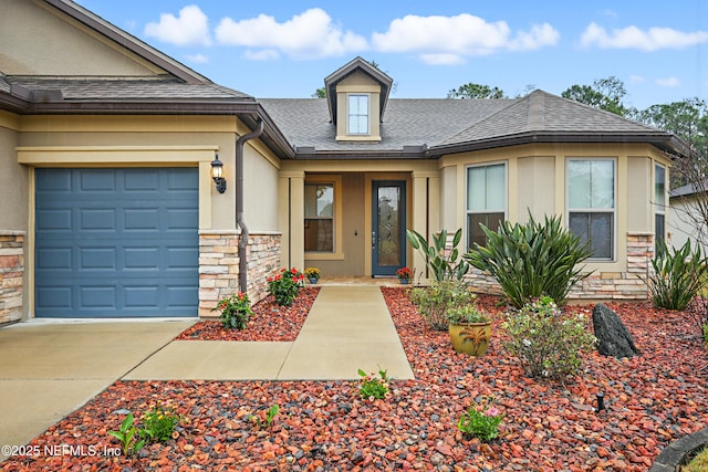 doorway to property with a garage, a shingled roof, stone siding, concrete driveway, and stucco siding