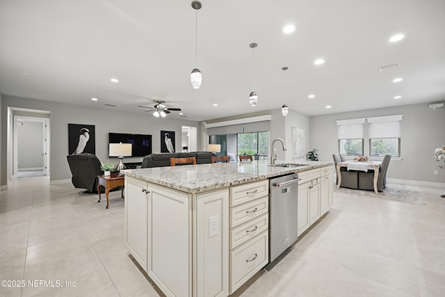 kitchen with a sink, open floor plan, stainless steel dishwasher, an island with sink, and pendant lighting