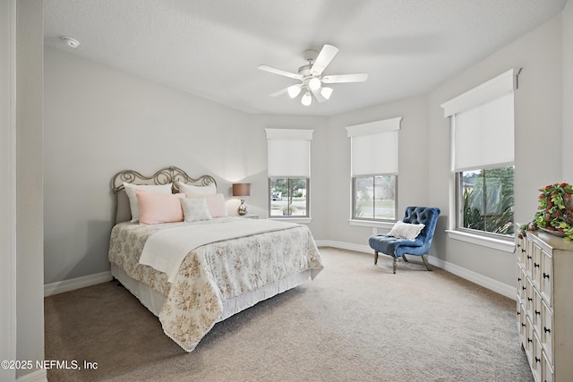 bedroom with carpet, baseboards, and ceiling fan