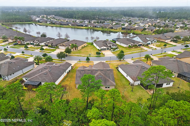 birds eye view of property featuring a water view and a residential view