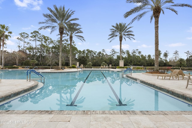 pool with a patio area