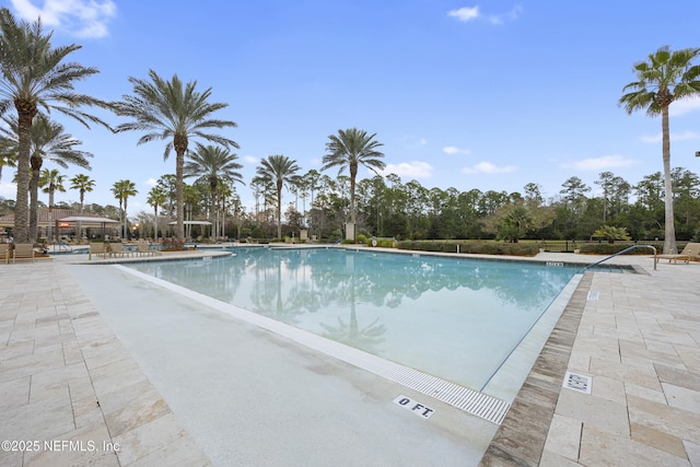 pool with a patio area