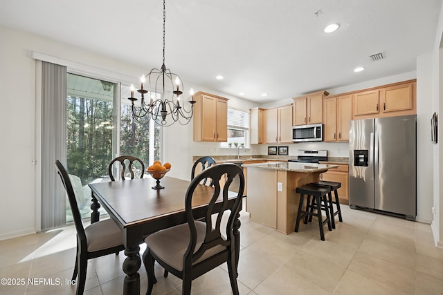 dining space with plenty of natural light, visible vents, and recessed lighting