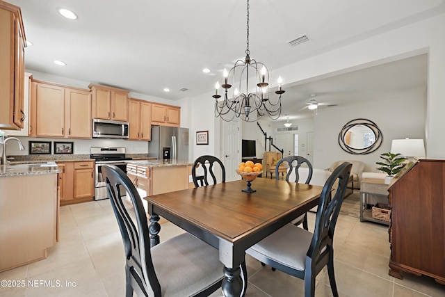 dining area featuring ceiling fan with notable chandelier, light tile patterned flooring, visible vents, and recessed lighting